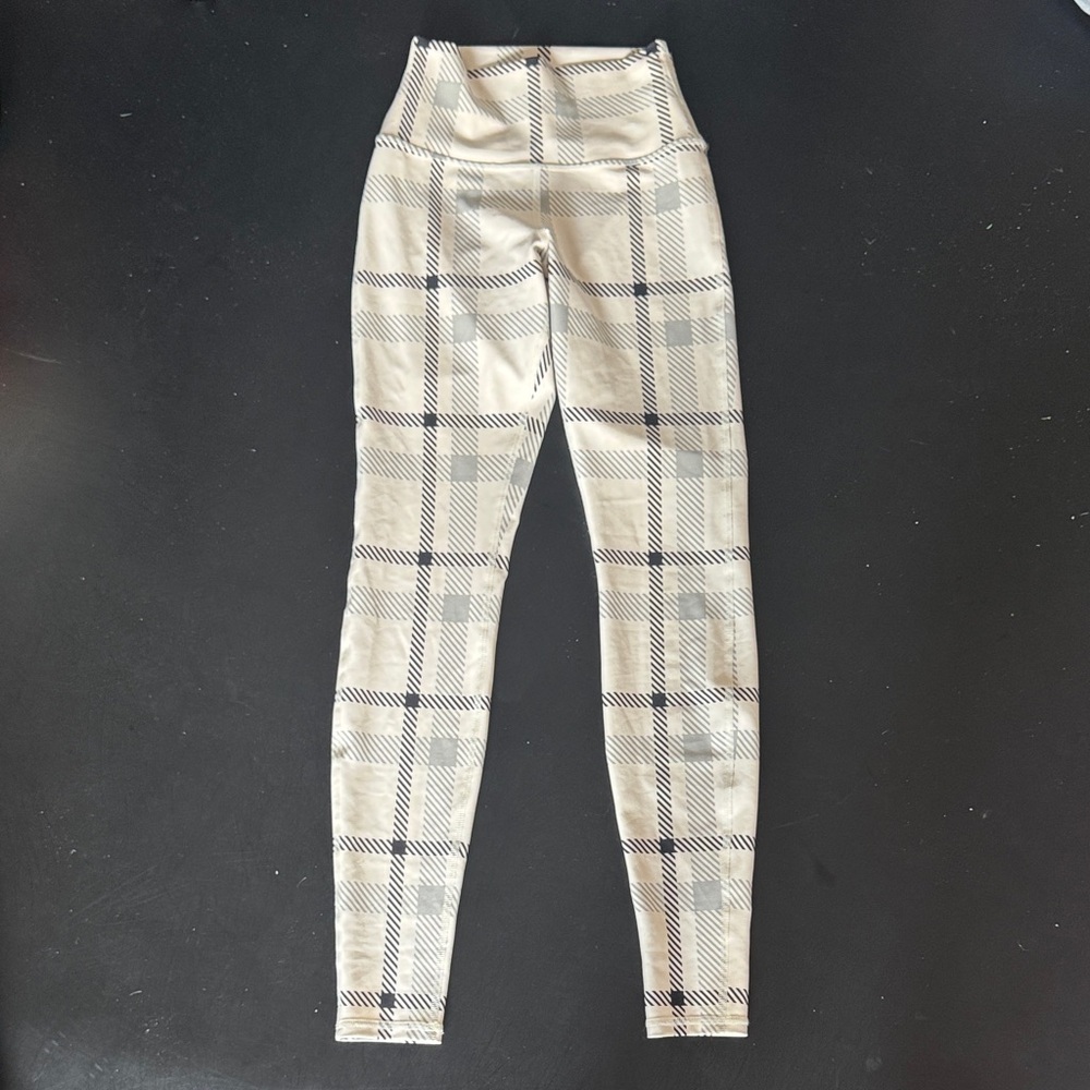 ALO Yoga Cream and Black Plaid Leggings